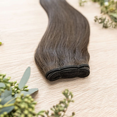 LINDEN MACHINE WEFT 50g Linden machine weft is a 22" weft featuring natual-toned level 2 ash brown. These machine wefts offer the highest weft density, along with the flexibility to be custom sized, colored, and cut according to your preferences. The mach