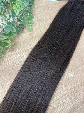 CLOVE INDIVIDUAL HANDTIED WEFT Clove is a 22" weft featuring natural level 3 with a warm copper undertone. Our hand-tied wefts are 22" in length and 11" in width, providing ample coverage for a voluminous result. Each individual weft weighs 20 grams, ensu