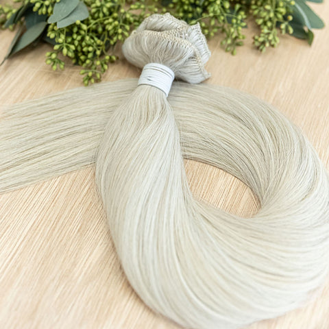 ASPEN CLIP IN Aspen clip-in hair extensions are 22 inches in length and made of a gorgeous weft of natural level10 ash platinum blonde. They provide instant density and length when applied to the hair. These clip-in extensions can be customized in terms o