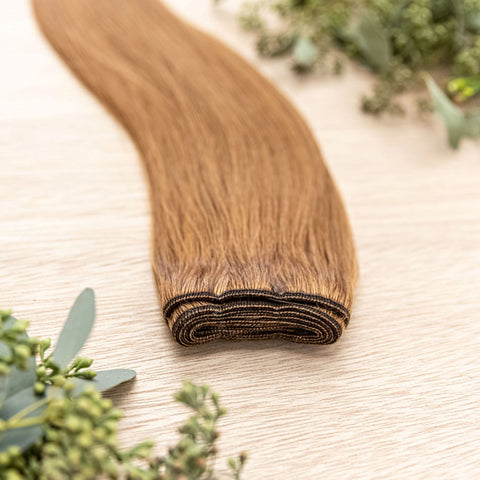 CEDAR MACHINE WEFT 50g Cedar machine weft is a 22" weft featuring natural-toned level 8 warm copper. These machine wefts offer the highest weft density, along with the flexibility to be custom sized, colored, and cut according to your preferences. The mac