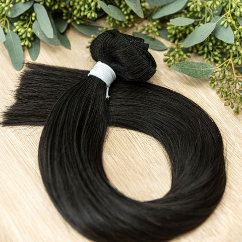 EBONY CLIP IN Ebony clip-in hair extensions are 22 inches in length and made of a gorgeous weft of natural-toned level 1 dark brown, warm undertone. They provide instant density and length when applied to the hair. These clip-in extensions can be customiz