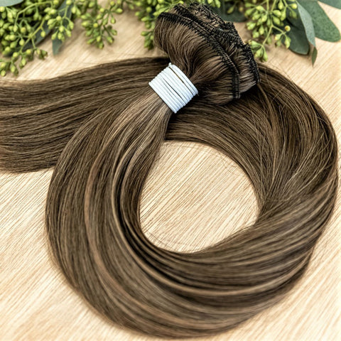 HICKORY CLIP IN Hickory clip-in hair extensions are 22 inches in length and made of a gorgeous weft of natural-toned level 2 brown and a level 8 warm blonde. They provide instant density and length when applied to the hair.These clip-in extensions can be