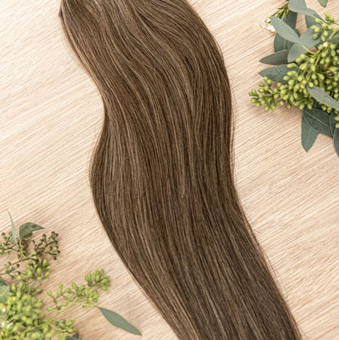 HICKORY NATURAL TAPE HIckory weft is a 22" piano weft featuring natural-toned level 2 ash and neutral level 8 warm blonde. Our natural tape hair extensions are carefully crafted to ensure a natural appearance and seamless blending. The hair is placed on t