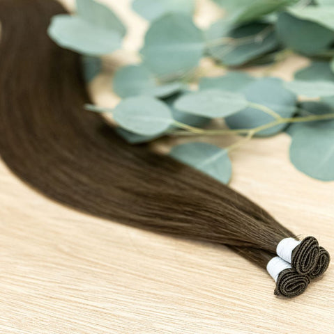 LINDEN INDIVIDUAL HANDTIED WEFT Linden is a 22" weft featuring natural level 2 warm brown. Our hand-tied wefts are 22" in length and 11" in width, providing ample coverage for a voluminous result. Each individual weft weighs 20 grams, ensuring lightweight