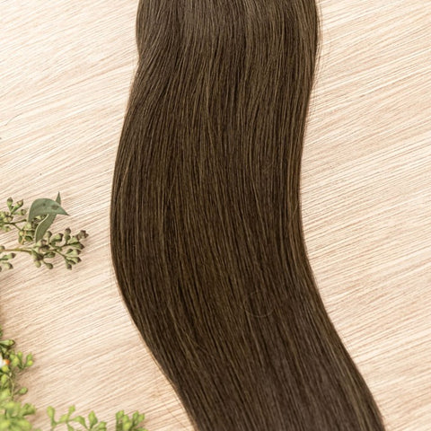 LINDEN NATURAL TAPE Linden weft is a 22" weft featuring natural-toned level 4 ash brown. Our natural tape hair extensions are carefully crafted to ensure a natural appearance and seamless blending. The hair is placed on the outside of the tape, allowing i