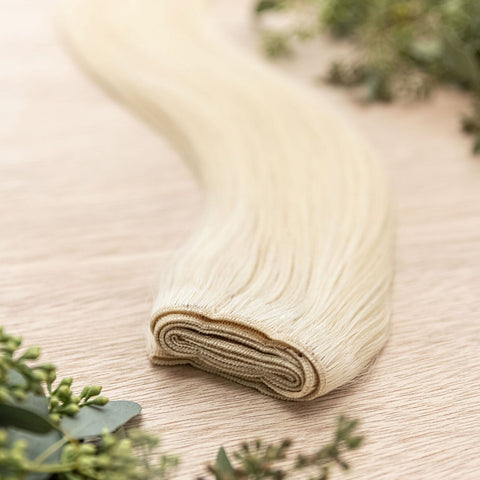 MAPLE MACHINE WEFT 50g Maple machine weft is a 22" weft featuring natural-toned level 9 true warm blonde. These machine wefts offer the highest weft density, along with the flexibility to be custom sized, colored, and cut according to your preferences. Th