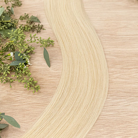 MAPLE NATURAL TAPE Maple weft is a 22" weft featuring natural-toned level 9 true warm blonde. Our natural tape hair extensions are carefully crafted to ensure a natural appearance and seamless blending. The hair is placed on the outside of the tape, allow