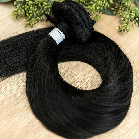 RAVEN CLIP IN Raven clip-in hair extensions are 22 inches in length and made of a gorgeous weft of natural-toned level 1 blue based black. They provide instant density and length when applied to the hair. These clip-in extensions can be customized in term