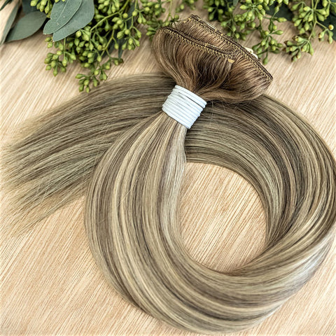 BIRCH CLIP IN- ROOTED Birch rooted clip-in hair extensions are 22 inches in length and made of a gorgeous weft of natural-toned level 7 ash and neutral level 10 ash blonde- rooted in a natural level 7. They provide instant density and length when applied