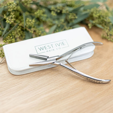 WEST IVIE HAIR CO. TAPE CLAMP The Stainless Steel Tape Clamp included in the kit is specifically designed for balanced and precise application of tape-in hair extensions. It is a tool that assists in securing the tape-in extensions to the natural hair. Th