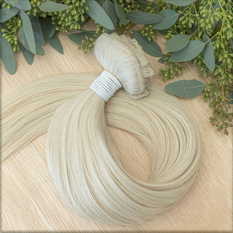 WILLOW CLIP IN Willow clip-in hair extensions are 22 inches in length and made of a gorgeous weft of natural-toned level 10 warm platinum blonde. They provide instant density and length when applied to the hair. These clip-in extensions can be customized