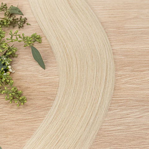 WILLOW NATURAL TAPE Willow weft is a 22" piano weft featuring natural-toned level 10 warm platinum blonde. Our natural tape hair extensions are carefully crafted to ensure a natural appearance and seamless blending. The hair is placed on the outside of th