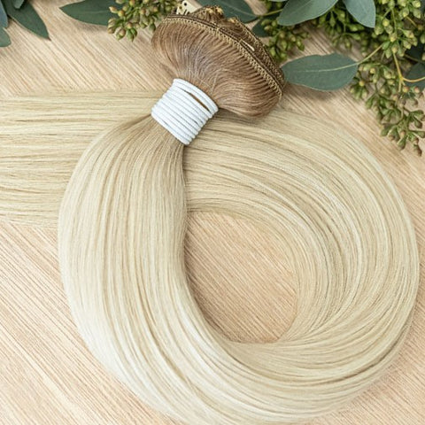 WILLOW CLIP IN- ROOTED Willow rooted clip-in hair extensions are 22 inches in length and made of a gorgeous weft of natural-toned level 10 warm platinum rooted in a soft level 7. They provide instant density and length when applied to the hair.These clip-