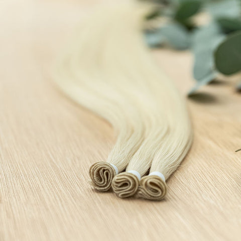 WILLOW INDIVIDUAL HANDTIED WEFT Willow is a 22" weft featuring natural level 10 warm platinum blonde. Our hand-tied wefts are 22" in length and 11" in width, providing ample coverage for a voluminous result. Each individual weft weighs 20 grams, ensuring